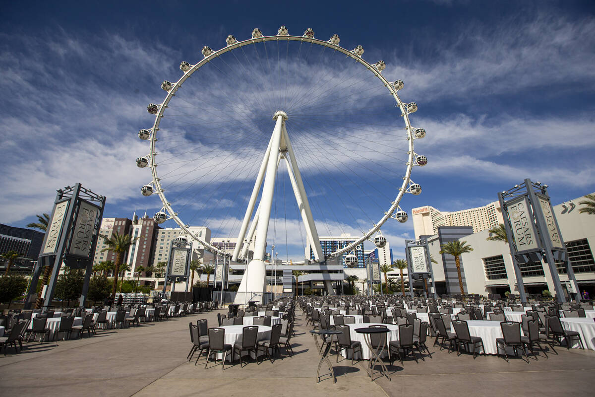 Chairs and tables are set at the Caesars Forum as the NFL Draft Theater, not pictured, is built ...