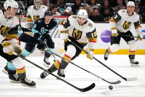 Vegas Golden Knights' Jake Leschyshyn (15) passes to Pavel Dorofeyev during the first period of ...