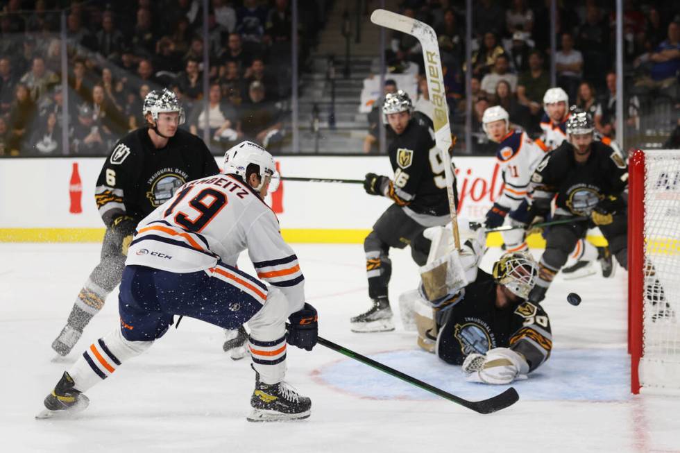 Bakersfield Condors Dino Kambeitz (19) shoots for a score against Henderson Silver Knights Jiri ...