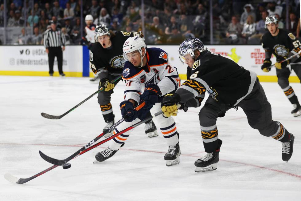 Bakersfield Condors Adam Cracknell (27) and Henderson Silver Knights Kaedan Korczak (6) battles ...