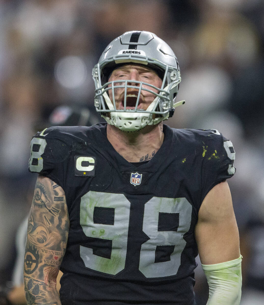 Raiders defensive end Maxx Crosby (98) shouts during the second half of an NFL football game ag ...