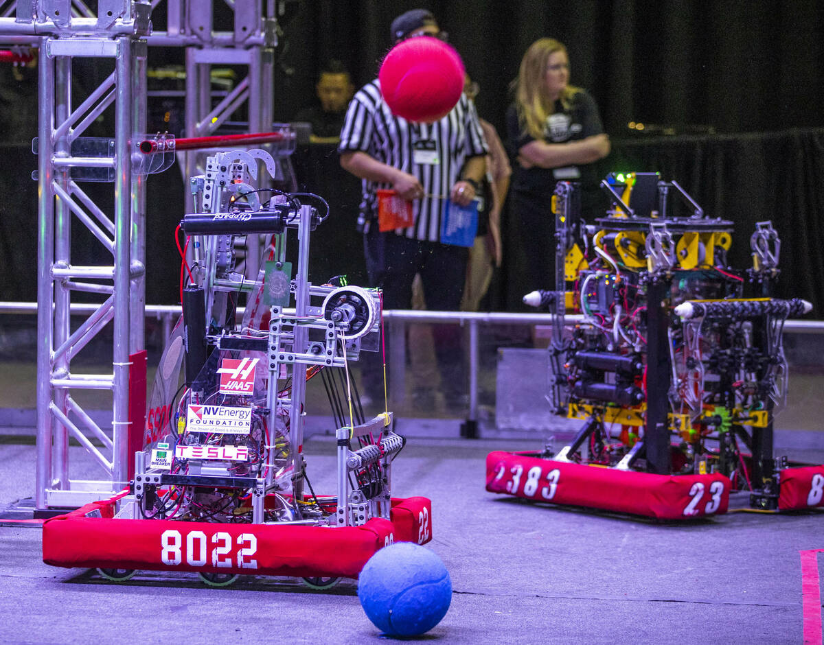 A robot from team Raging Hawk Robotics of the Northwest Career & Tech Academy launches a sh ...