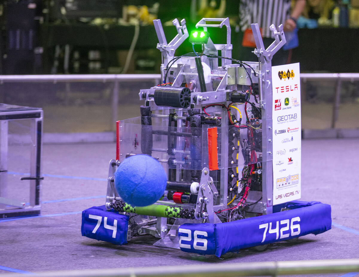 The Pair of Dice Robotics robot from Southeast Career Technical Academy looks to reload during ...