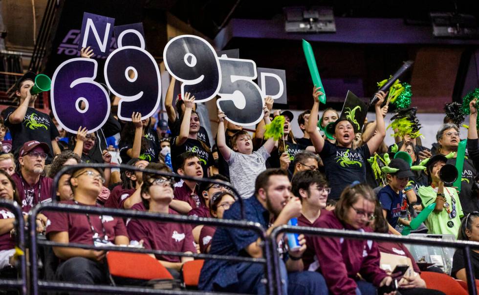 Fans from team Nomad of Escondido, Calif., cheer on their competitors during the FIRST Robotics ...