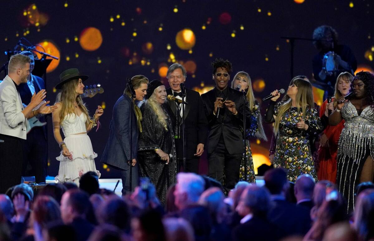 Joni Mitchell, fourth from left, and artists perform "Big Yellow Taxi" at the conclusion of the ...
