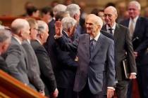 The Church of Jesus Christ of Latter-day Saints President Russell M. Nelson, center, waves as h ...