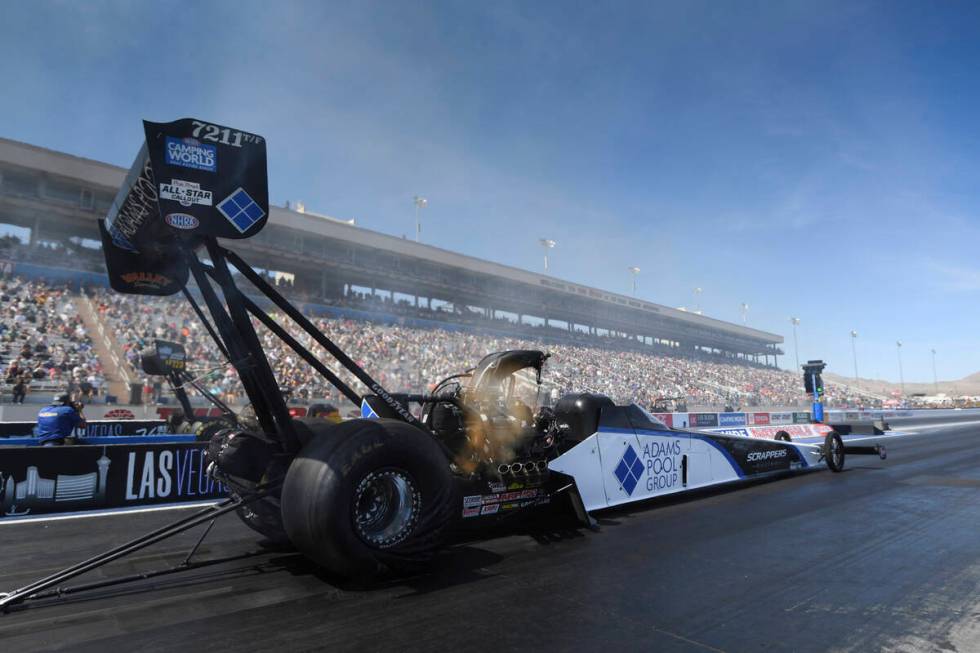 In this photo provided by the NHRA, Mike Salinas drives in Top Fuel qualifying Saturday, April ...