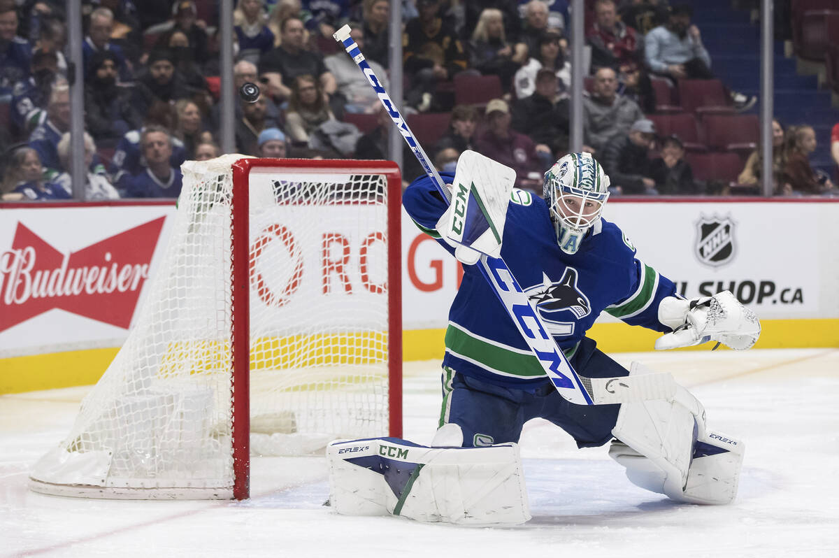 Vancouver Canucks goalie Thatcher Demko makes a blocker save during the second period of an NHL ...