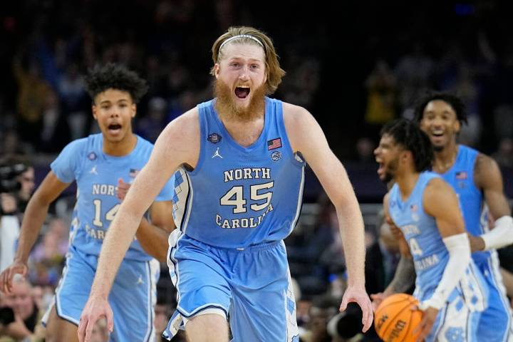 North Carolina's Brady Manek (45) celebrates after beating Duke in a college basketball game du ...