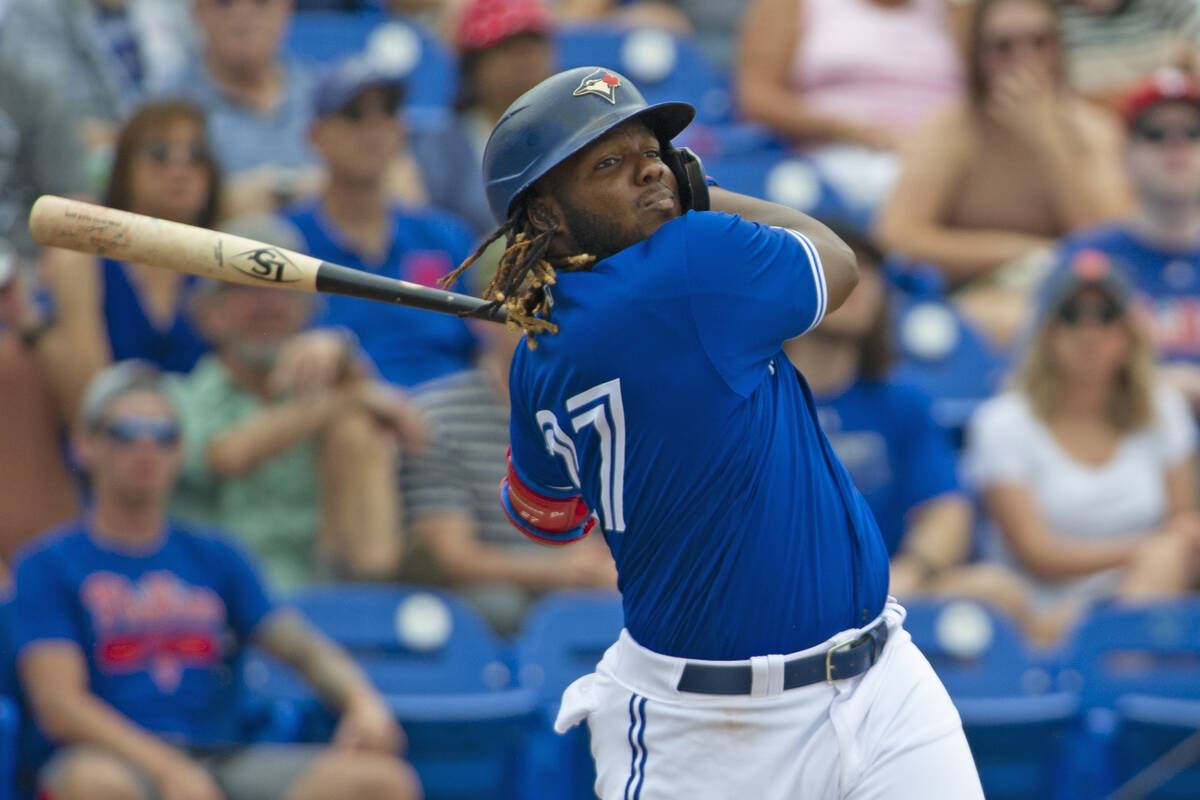 Toronto Blue Jays' Vladimir Guerrero Jr. swings during a spring training baseball game against ...