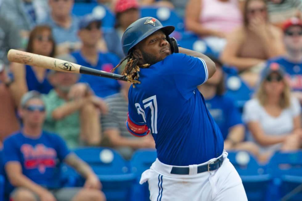 Toronto Blue Jays' Vladimir Guerrero Jr. swings during a spring training baseball game against ...