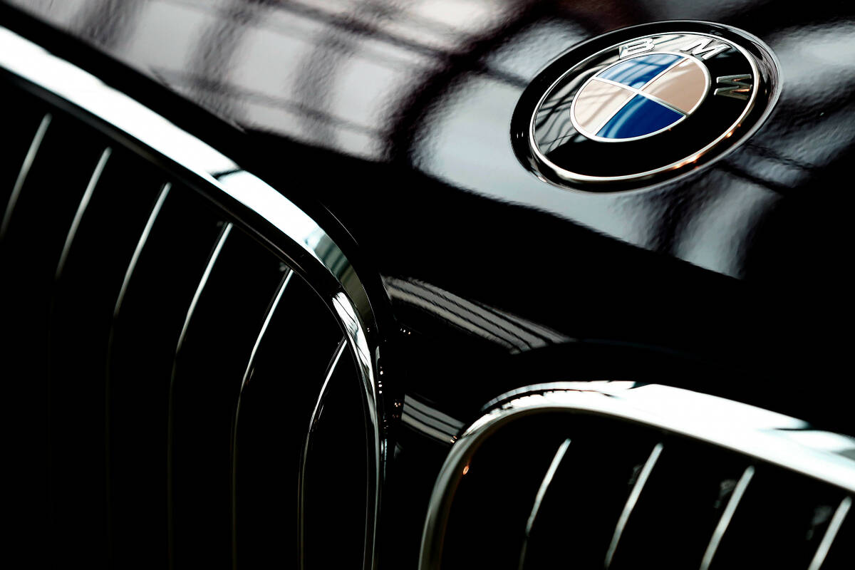 FILE - The logo of German car manufacturer BMW is pictured on a BMW 7 car prior to the earnings ...