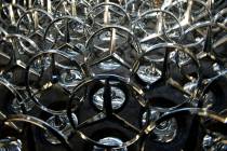 FILE - Mercedes stars, are on display at the Daimler-Benz factory in Sindelfingen, southern Ger ...
