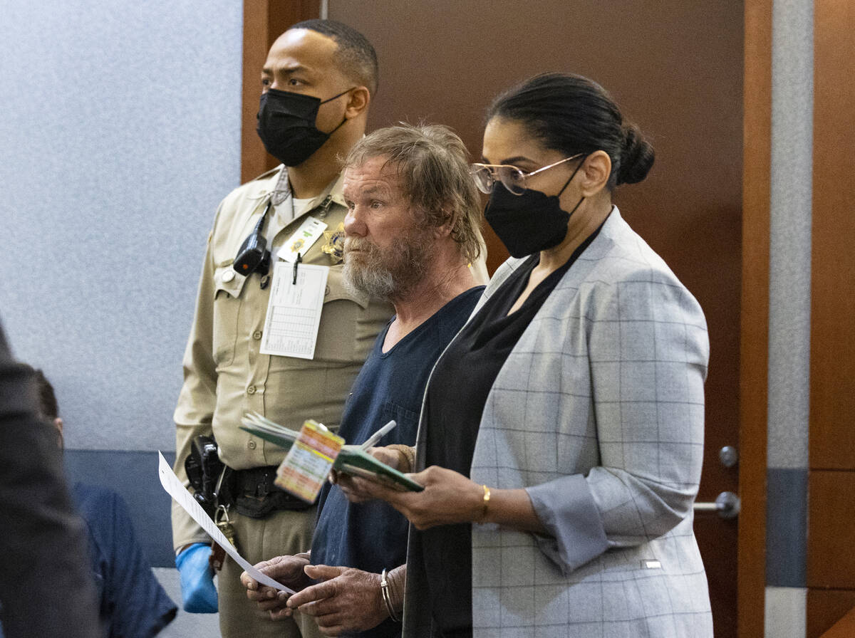 Freddy Allen, center, accused of fatally stabbing a police officer on the Strip, appears in cou ...