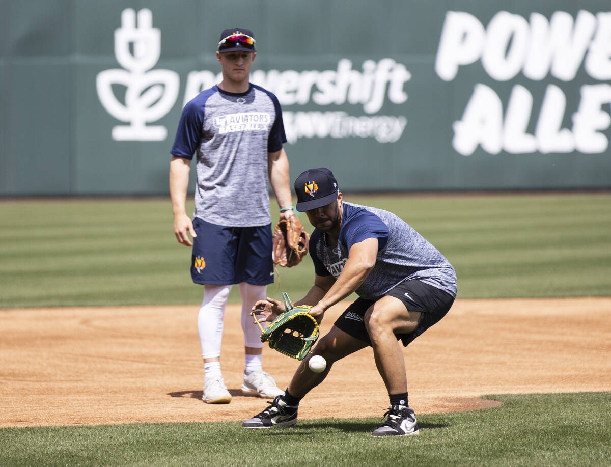 The Las Vegas Aviators infielder Vimael Machin (9) catches the ball as outfielder Marty Bechina ...