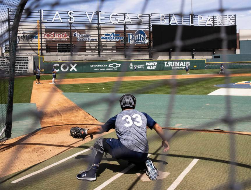 The Las Vegas Aviators catcher Shea Langeliers (33) catches the ball during media day practice ...