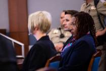 Michael Alan Lee, convicted in the murder of a 2-year-old, center, looks on next to defense att ...
