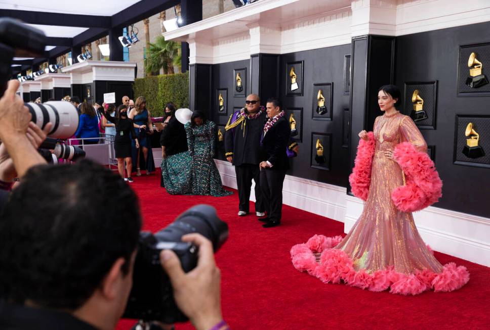 St. Vincent, right, on the red carpet before the start of the 2022 Grammy Awards on Sunday, Apr ...