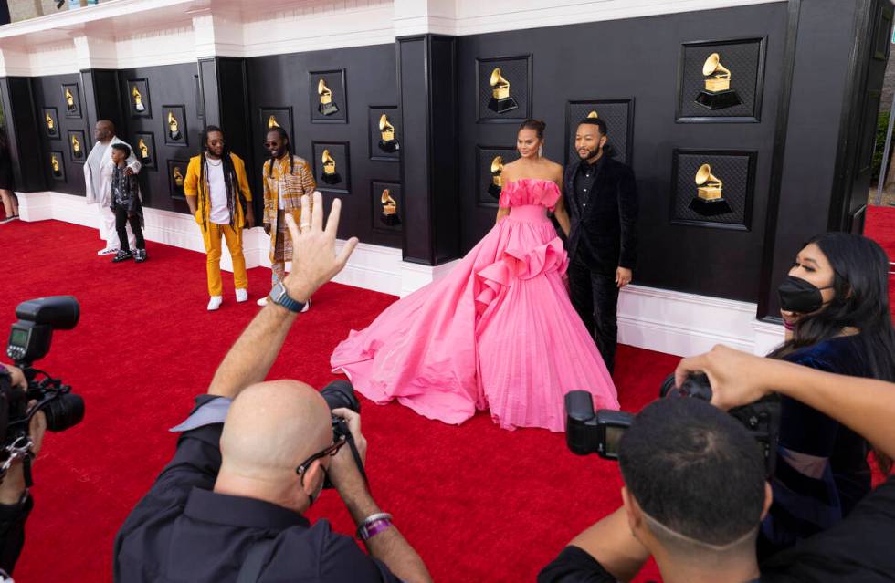 John Legend, top/right, and wife Chrissy Teigen on the red carpet before the start of the 2022 ...