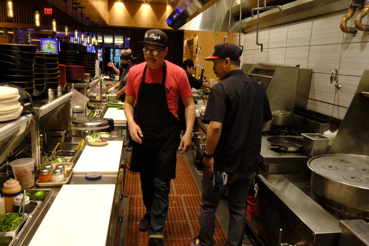Dan Coughlin, left, chef and owner of 8 East in Circa Resort & Casino, and Chef AJ, right, prep ...