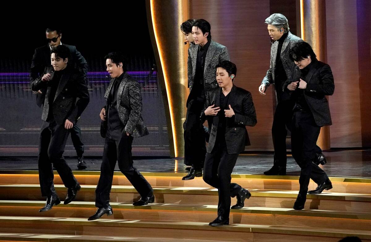 BTS performs "Butter" at the 64th Annual Grammy Awards on Sunday, April 3, 2022, in Las Vegas. ...