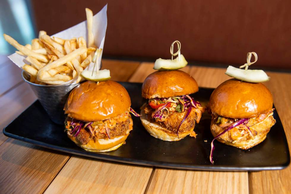 The fried chicken sliders served with kimchi slaw, pickles and sriracha aioli at Lumin Cafe ins ...