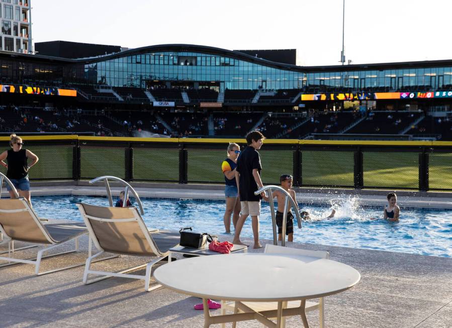 Children swim as they wait for the Las Vegas Aviators home opener game against Reno Aces to sta ...