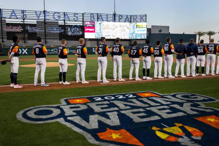 Las Vegas Aviators players place their hands over their heart during the National Anthem prior ...