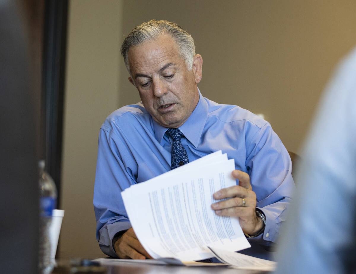 Clark County Sheriff Joe Lombardo reviews some documents during an interview with the Review-Jo ...