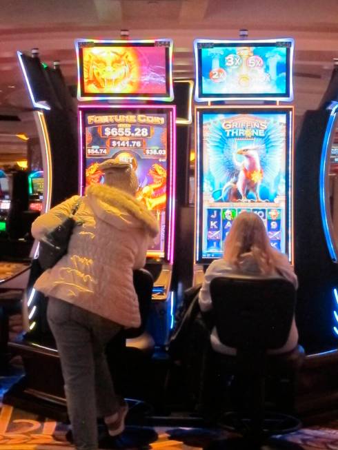 This Jan. 27, 2022, photo shows gamblers playing a slot machines at Caesars casino in Atlantic ...