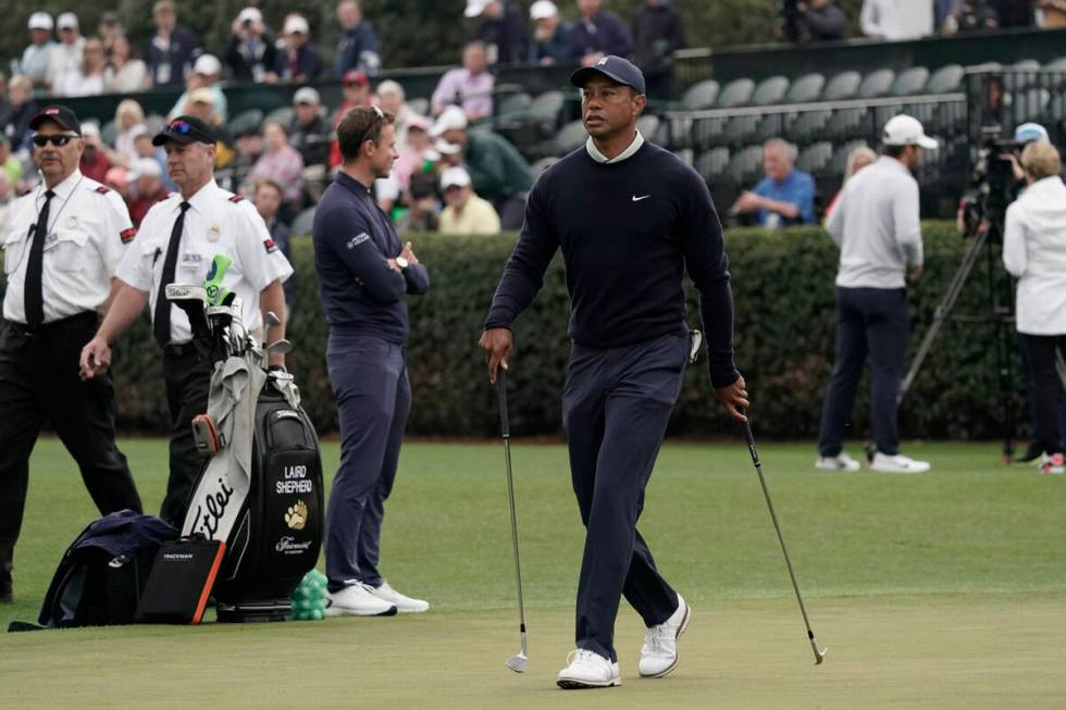 Tiger Woods arrives on the driving range during a practice round for the Masters golf tournamen ...