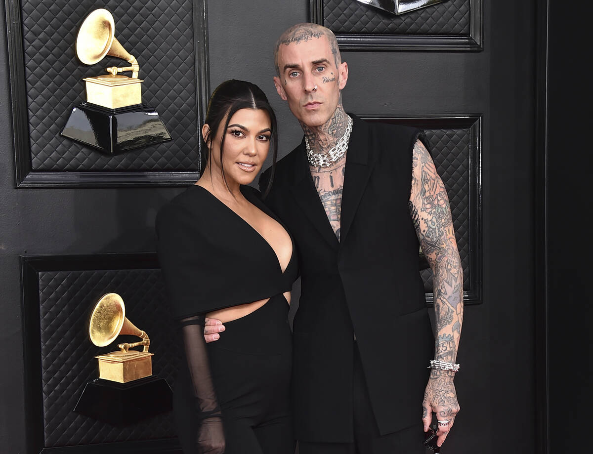 Kourtney Kardashian, left, and Travis Barker appear at the 64th Annual Grammy Awards in Las Veg ...