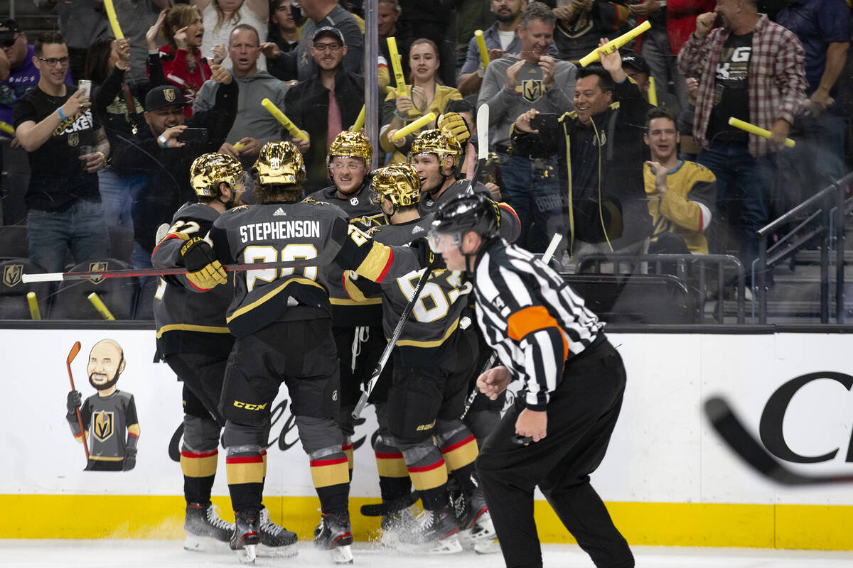 The Golden Knights celebrate after center Jack Eichel, center, scored a goal assisted by defens ...