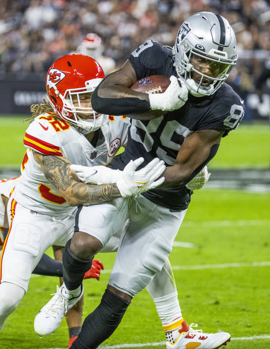 in this Nov. 14, 2021, file photo, Raiders wide receiver Bryan Edwards (89) attempts to break t ...