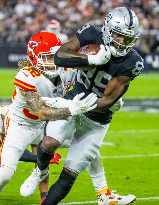 in this Nov. 14, 2021, file photo, Raiders wide receiver Bryan Edwards (89) attempts to break t ...