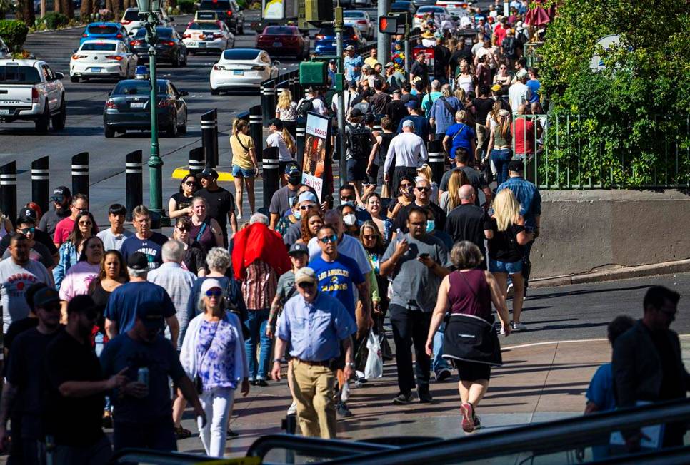 Pedestrians crowd the Las Vegas Strip on Wednesday, April 6, 2022, outside of the Miracle Mile ...