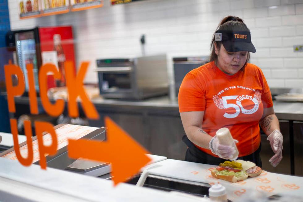 Employee Vanessa Naranjo crafts a sandwich at the Togo’s sandwich shop in Southern Highl ...