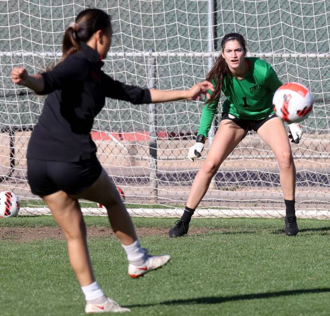 Hevanilea Haunga shoots on goalkeeper Charlotte Brisley during UNLV women’s soccer team ...