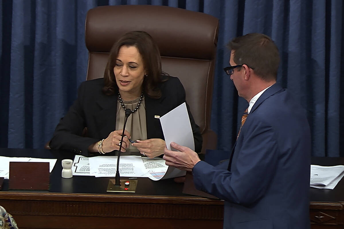 In this image from video from Senate Television, Vice President Kamala Harris prepares to read ...