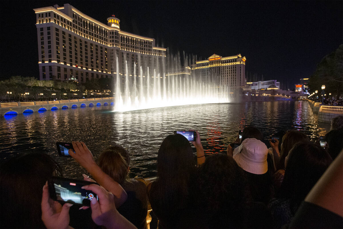 BTS fans line up as the Bellagio Fountain plays a show to songs “Butter” and &#x2 ...