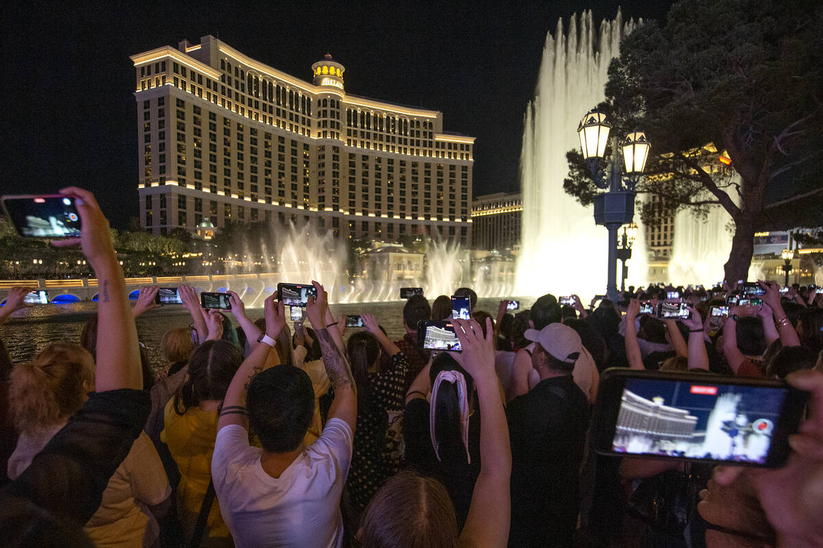 BTS fans record as the Bellagio Fountain plays a show to songs “Butter” and &#x20 ...