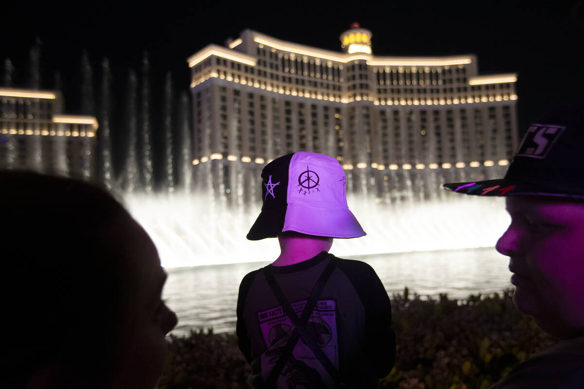 A BTS fan wears a themed hat during a Bellagio Fountain show on Thursday, April 7, 2022, in Las ...