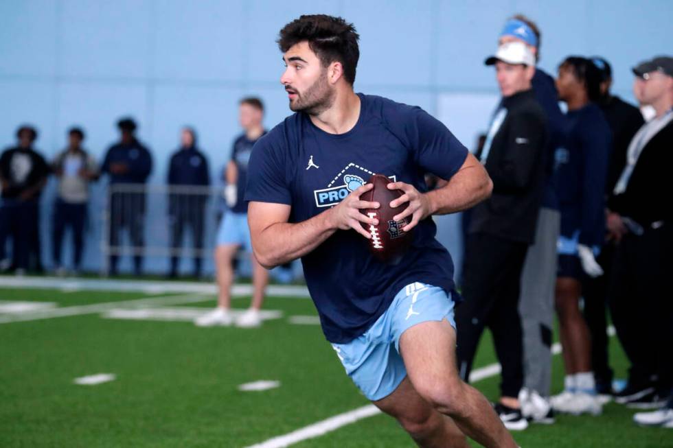 North Carolina quarterback Sam Howell demonstates his skills for NFL scouts during Pro Day, Mon ...