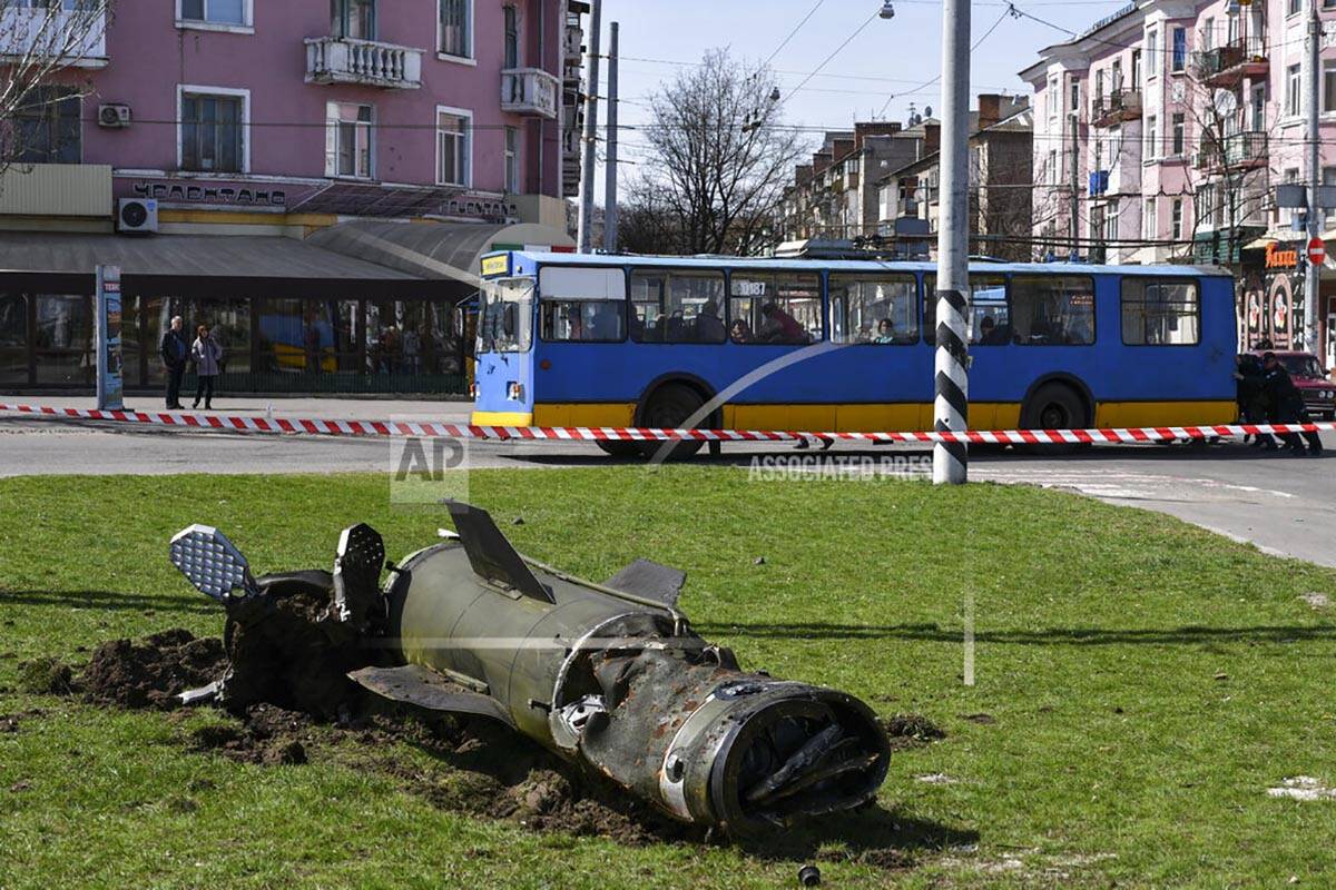 A fragment of a Tochka-U missile lies on the ground following an attack at the railway station ...