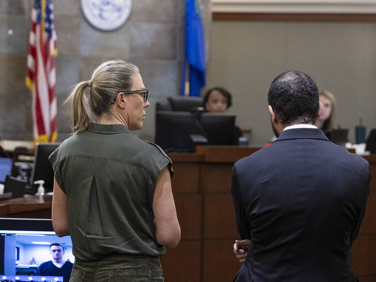 Chief Deputy District Attorney Michelle Fleck, center, and prosecutor Christopher Hamner addres ...