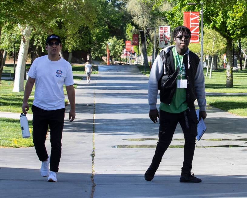 Students walk around campus at UNLV on Friday, April 8, 2022, in Las Vegas. UNLV is becoming a ...