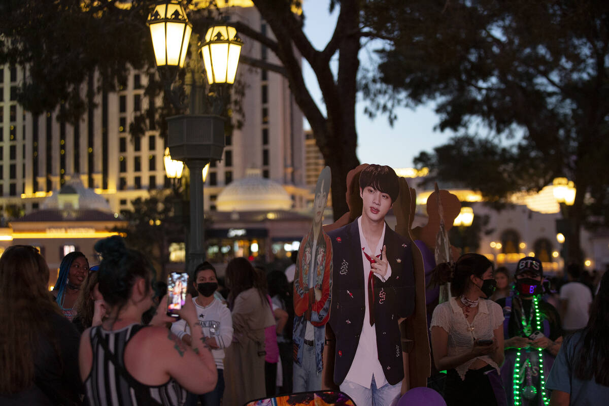 Fans photograph BTS cutouts at Bellagio Fountain while it features songs “Butter” ...