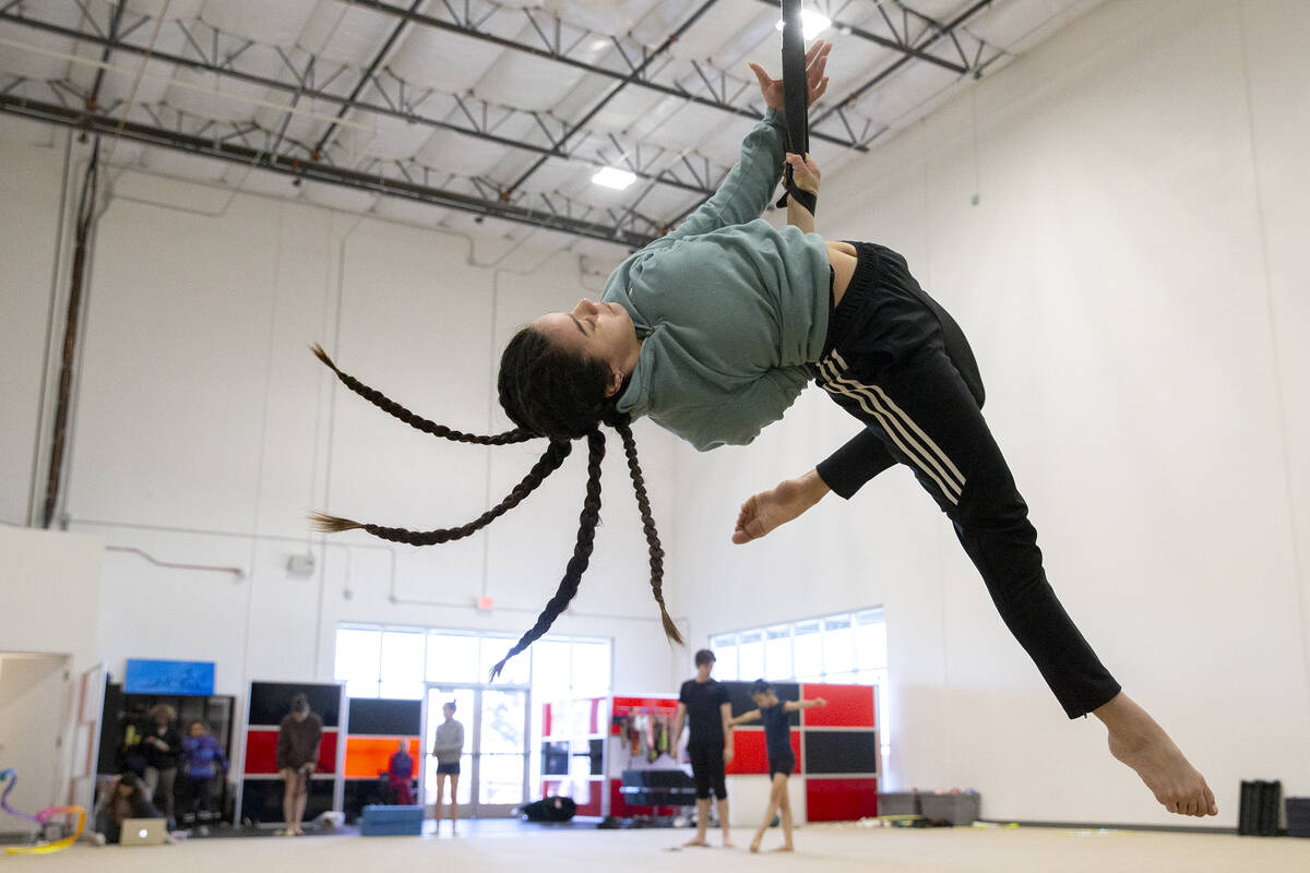 Gabby Castro, who plays the water nymph in IGNITE, rehearses aerial stunts at Nevada Rhythmic A ...