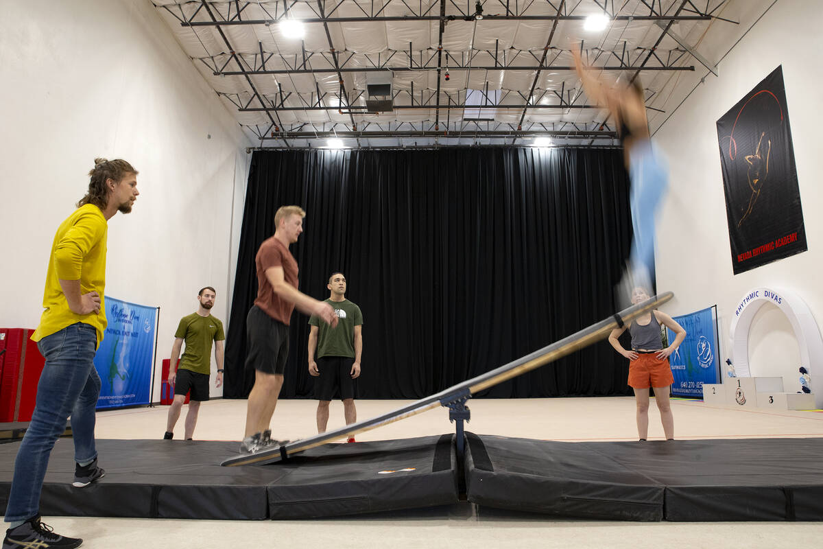 Charles Keidel and Rebekah Bubnar rehearse the teeterboard section during rehearsal for IGNITE ...