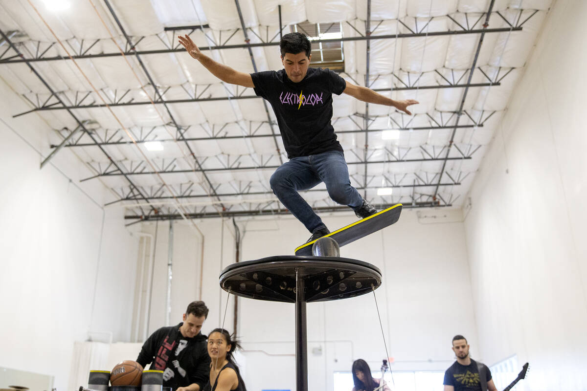 Jonathan Rinny practices his balancing stunt during rehearsal for IGNITE at Nevada Rhythmic Aca ...